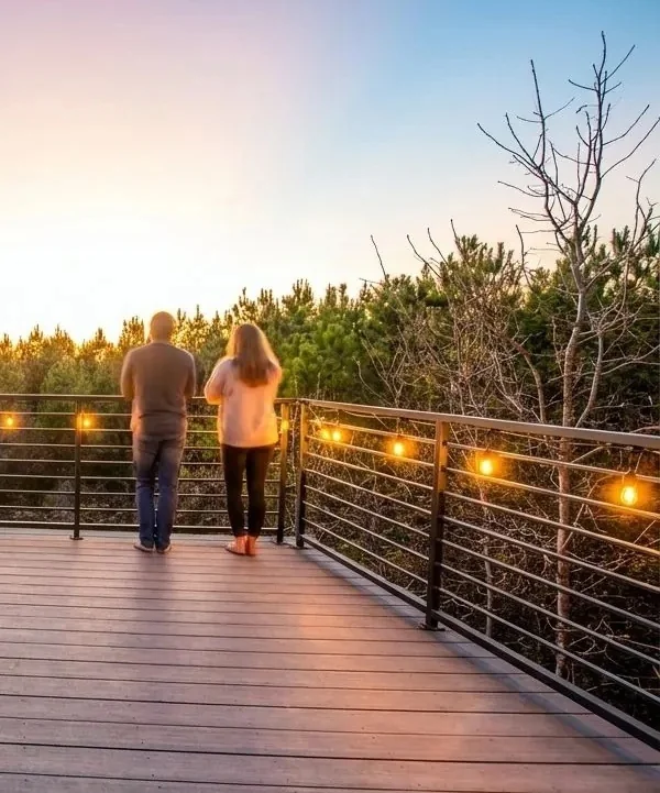 Guests enjoying the view from a Broken Bow cabin deck