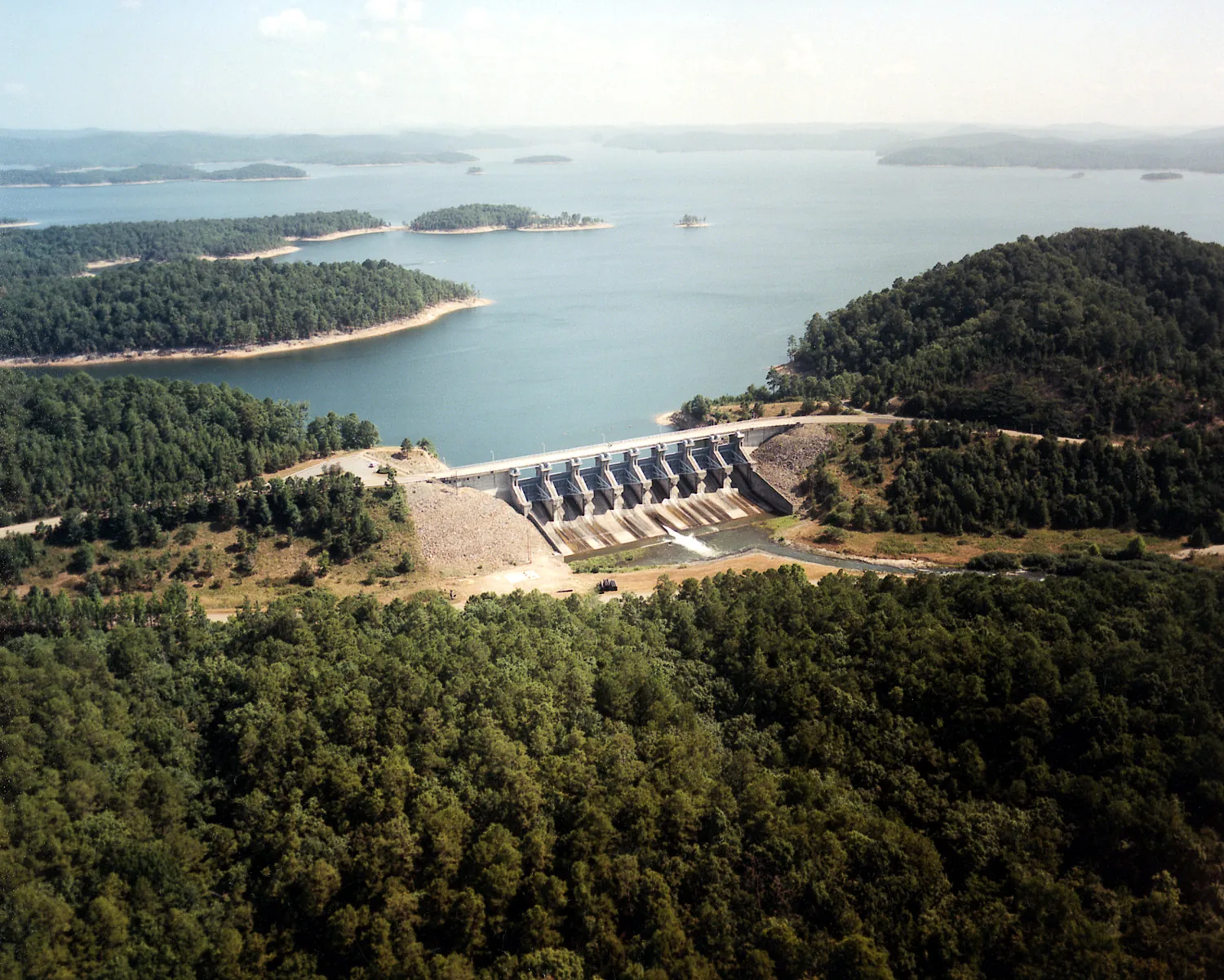 Aerial view of the Broken Bow Lake dam and forest