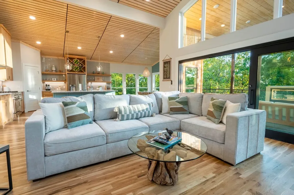 Living room seating around the fireplace at The Aroha