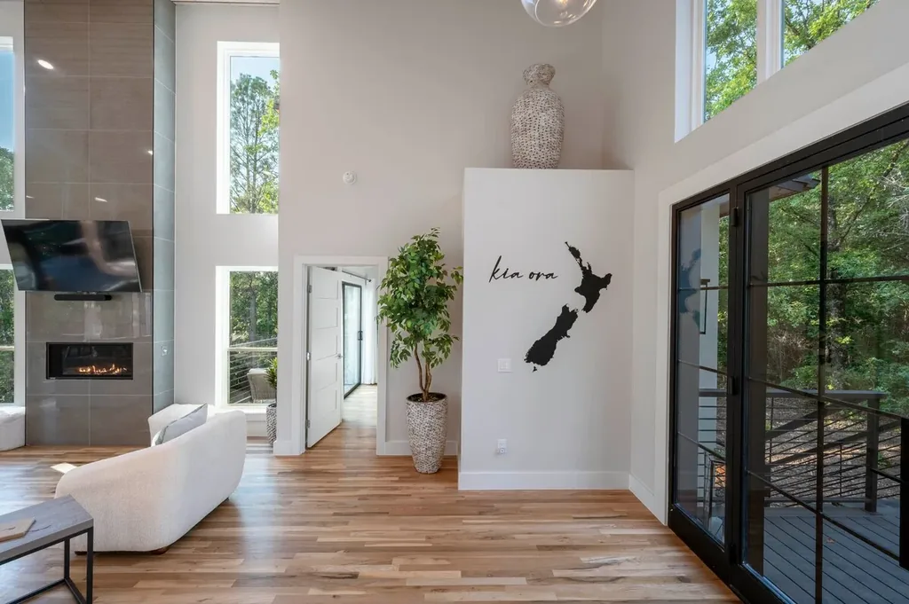 Living room windows and forest view at The Aroha