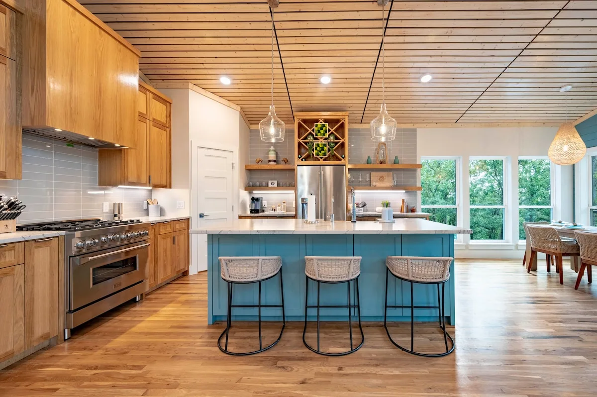 Wide view of The Aroha gourmet kitchen and island