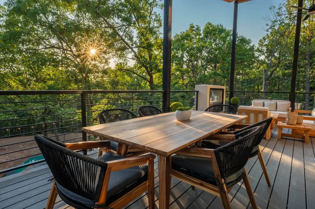 Covered outdoor dining table and lounge at The Aroha