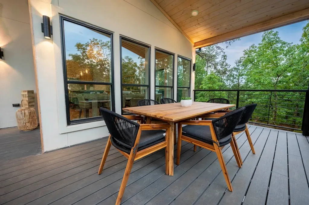 Outdoor dining table on The Aroha's covered deck