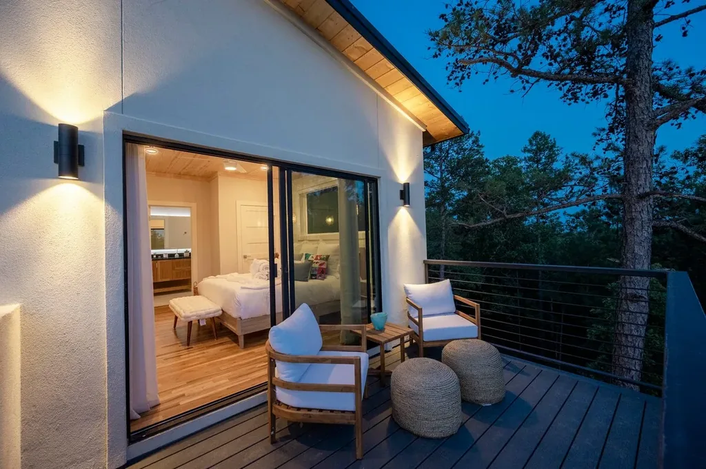 King Suite 1 private deck illuminated at twilight