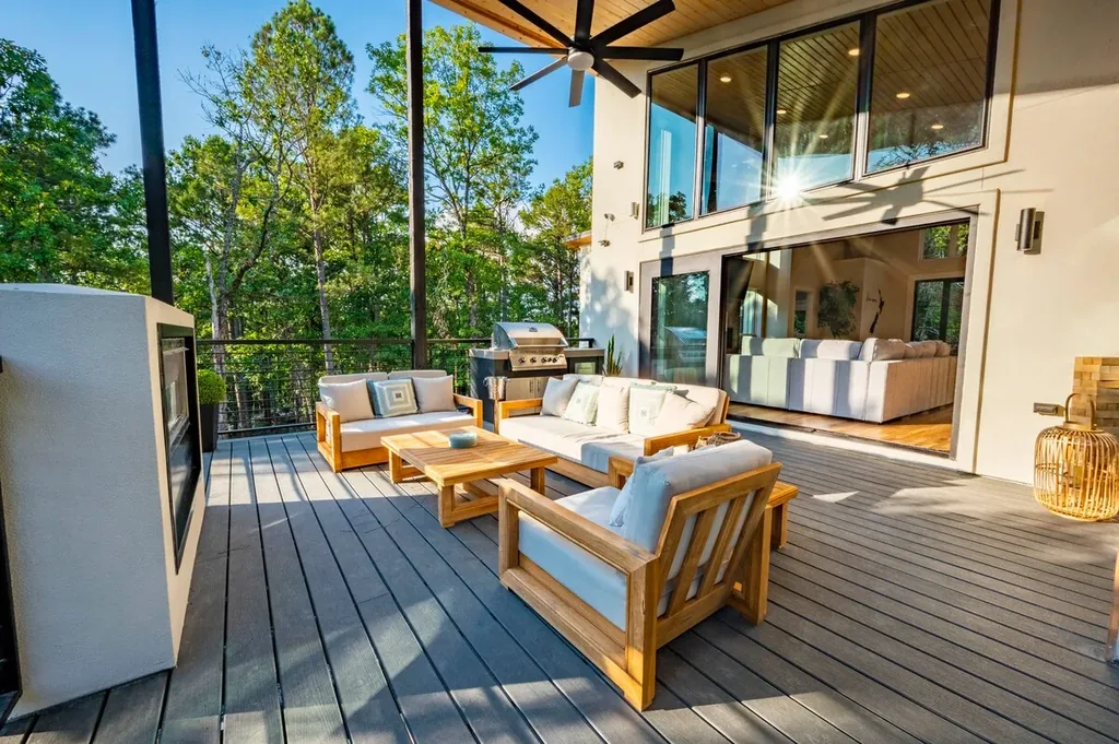 Covered outdoor living room opening to The Aroha's great room