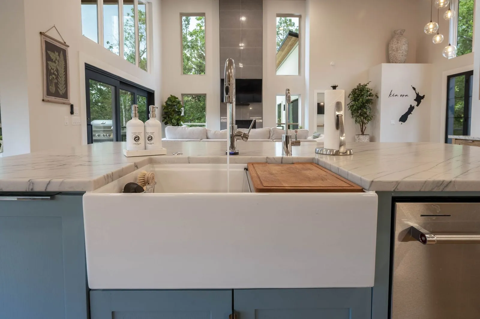 Kitchen at The Aroha with a farmhouse sink and New Zealand wall art