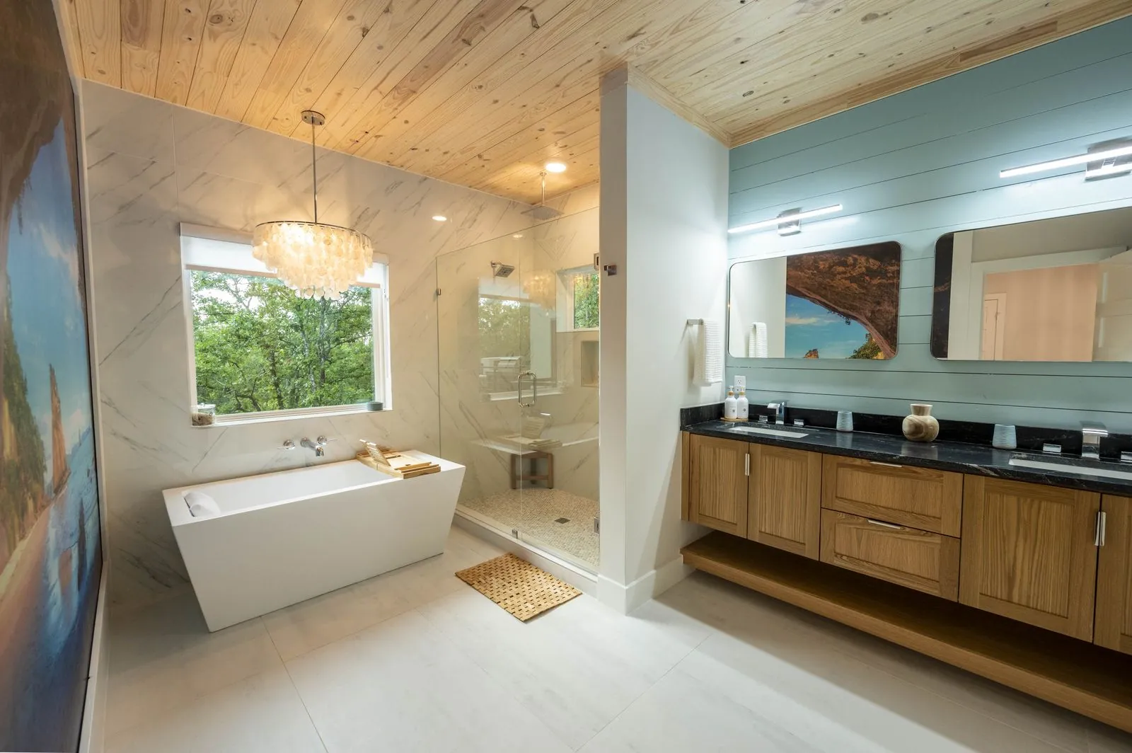 Kia ora artwork and farmhouse sink in The Aroha kitchen with fiddle-leaf fig plant