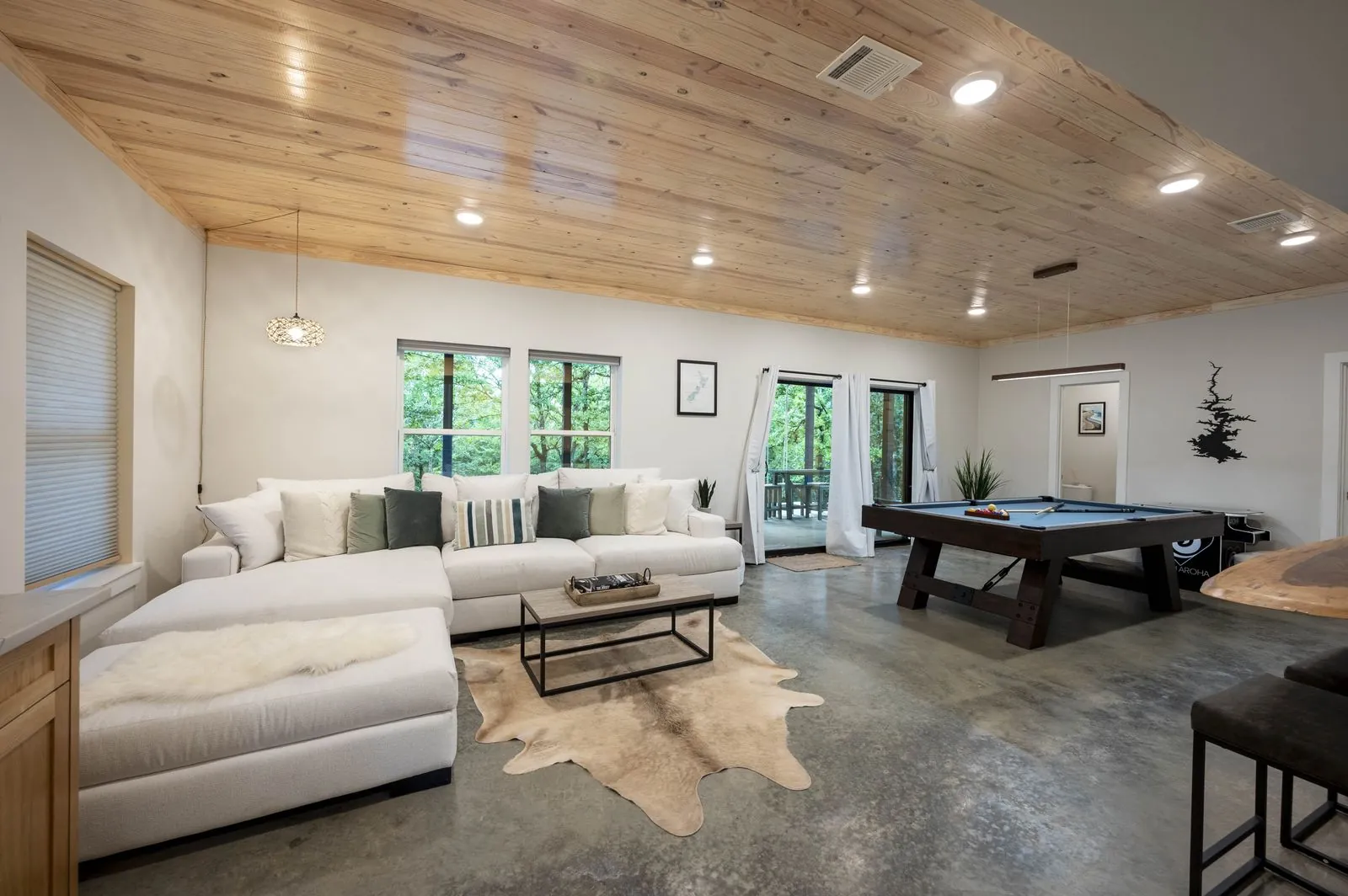 Game room at The Aroha with a pool table and forest views