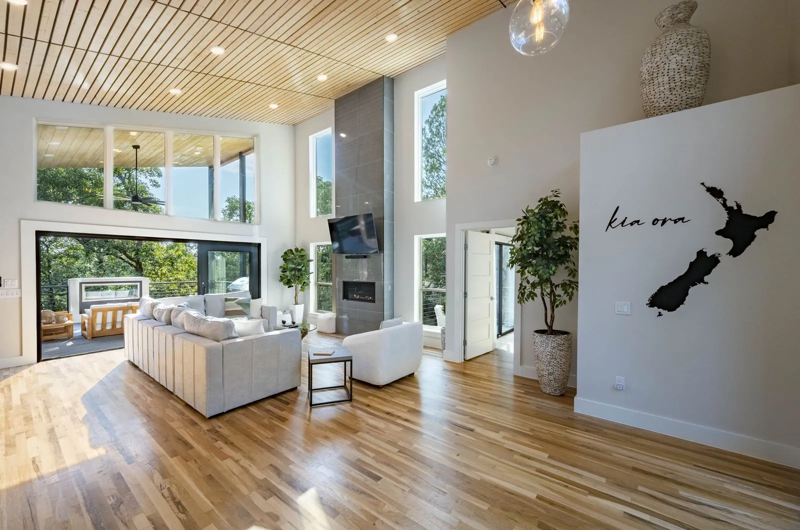 Kia ora New Zealand map canvas artwork on the wall at The Aroha luxury cabin