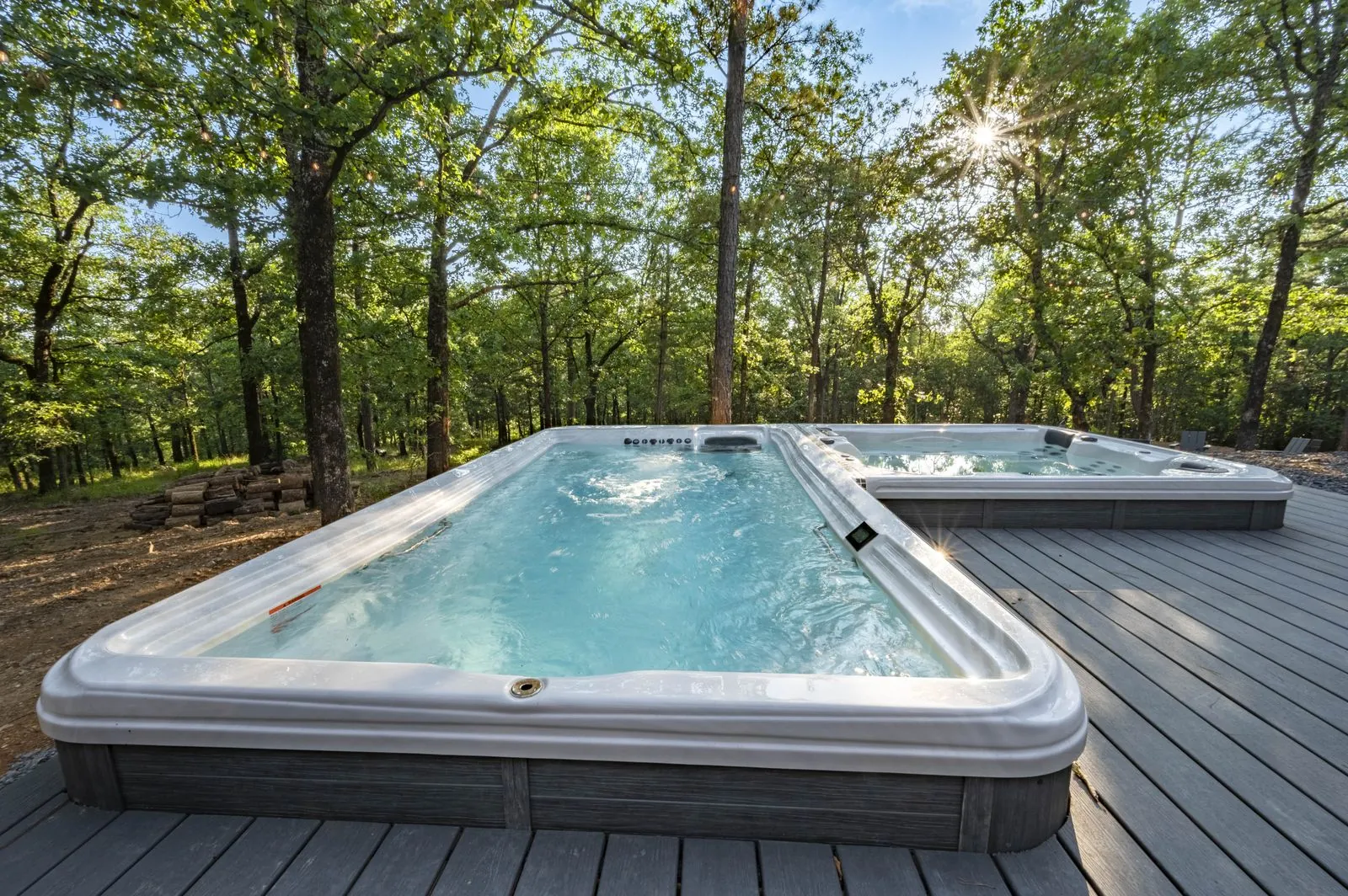 Hot tub on the deck at The Aroha surrounded by hardwoods