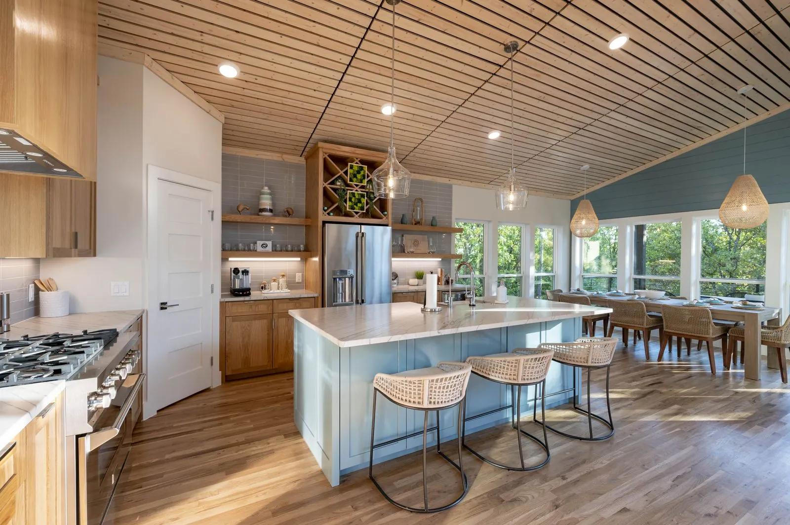 Wicker pendant light detail hanging from the covered deck ceiling at The Aroha