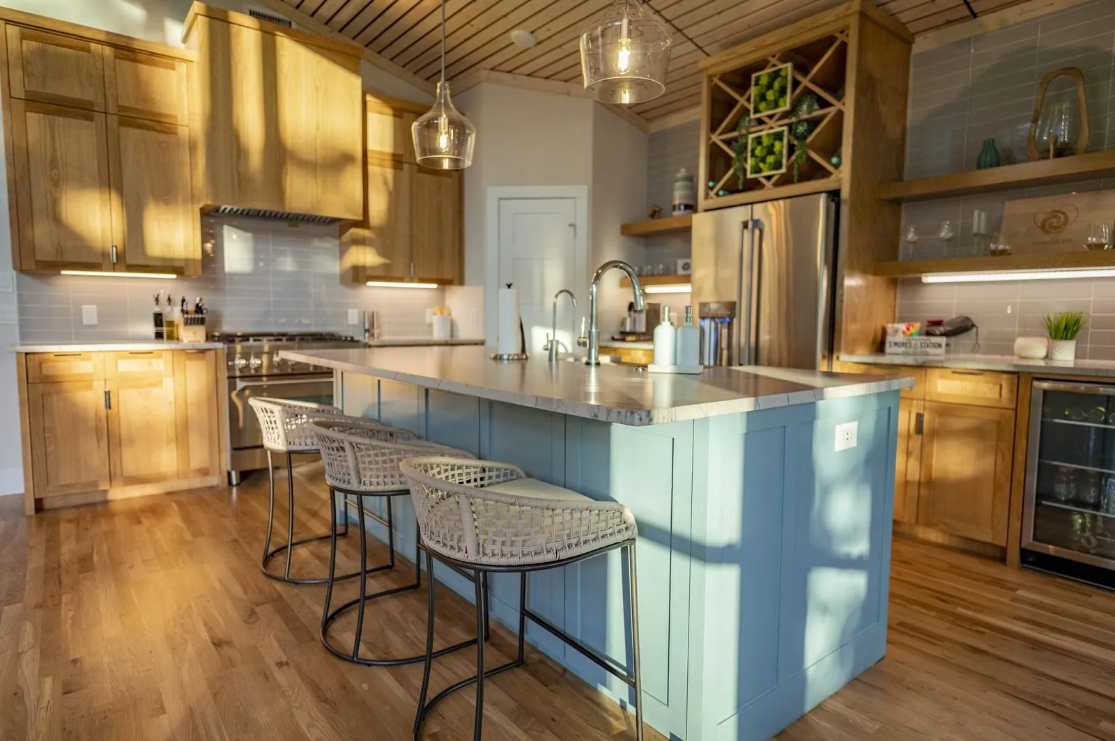Wooden knife block on counter at The Aroha kitchen with blue tile backsplash