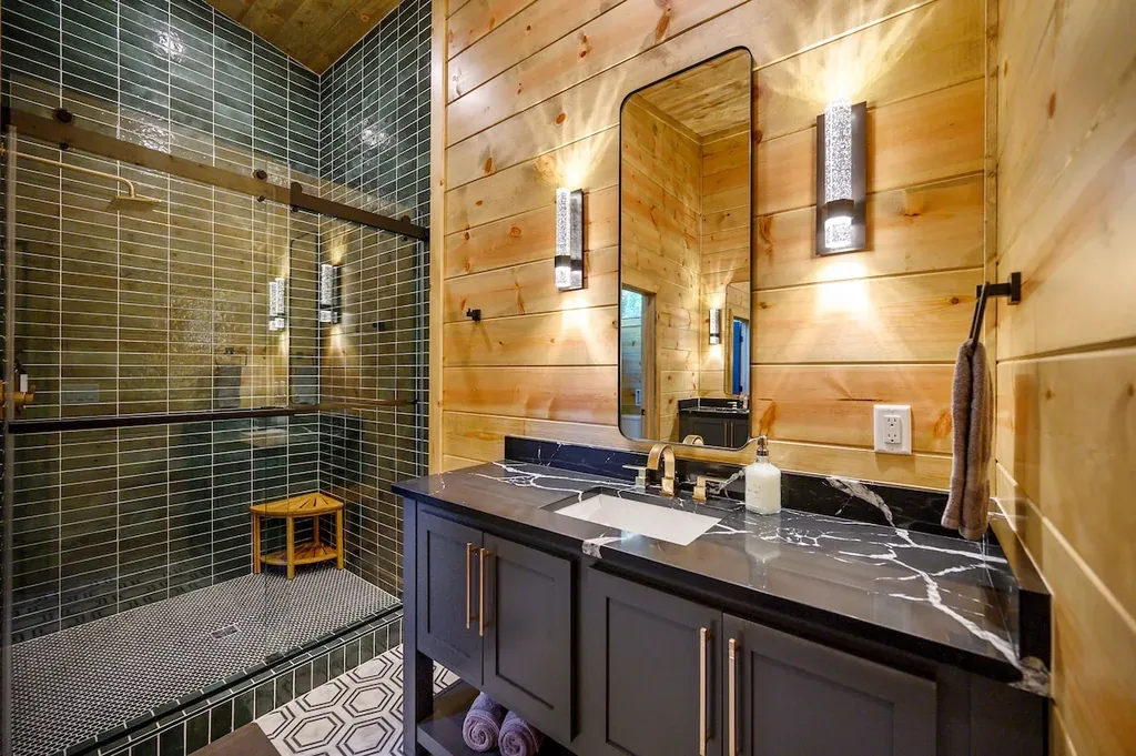 Full Bathroom 2 with green tiled shower and black vanity