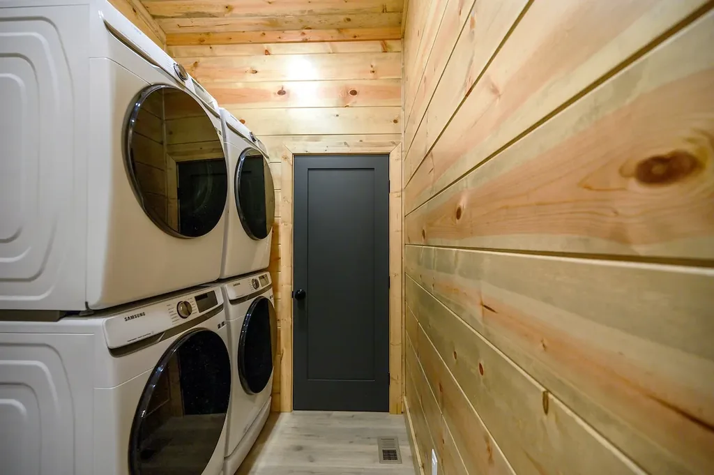 Laundry room with two stacked washer and dryer sets