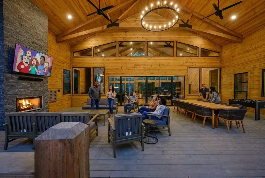 Guests relaxing around the covered outdoor fireplace