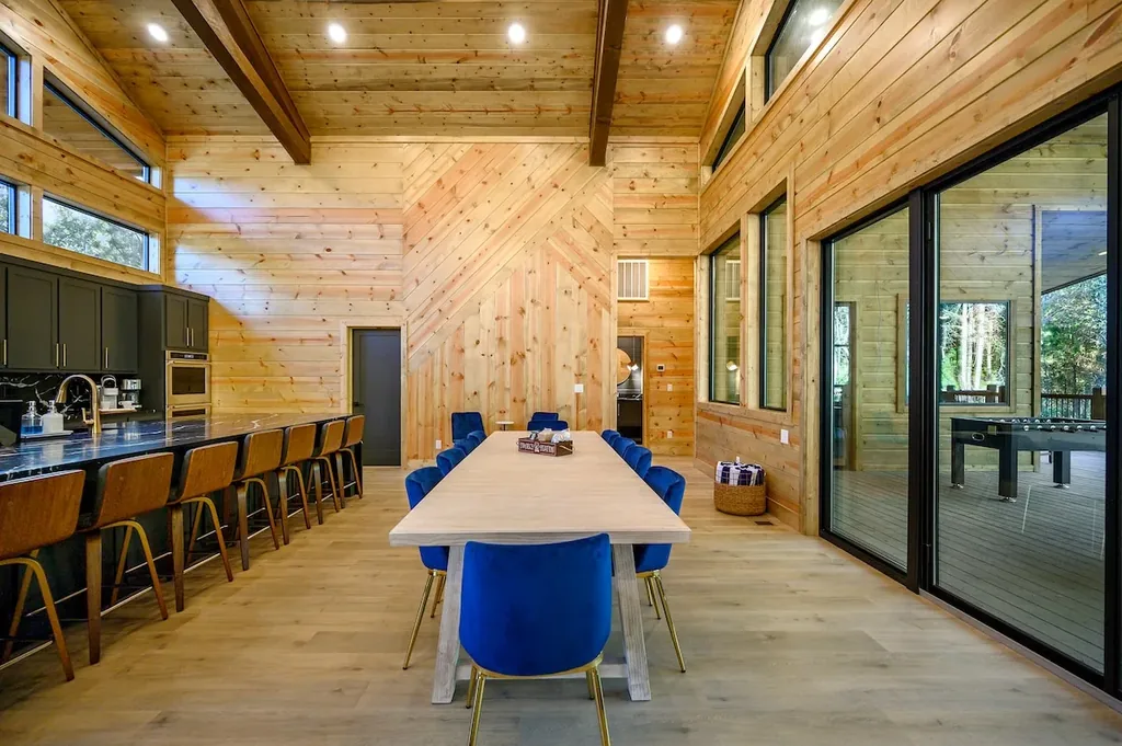 Dining area between the kitchen island and deck doors