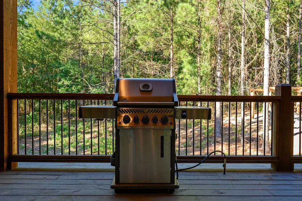 Gas grill and forest view from the covered deck