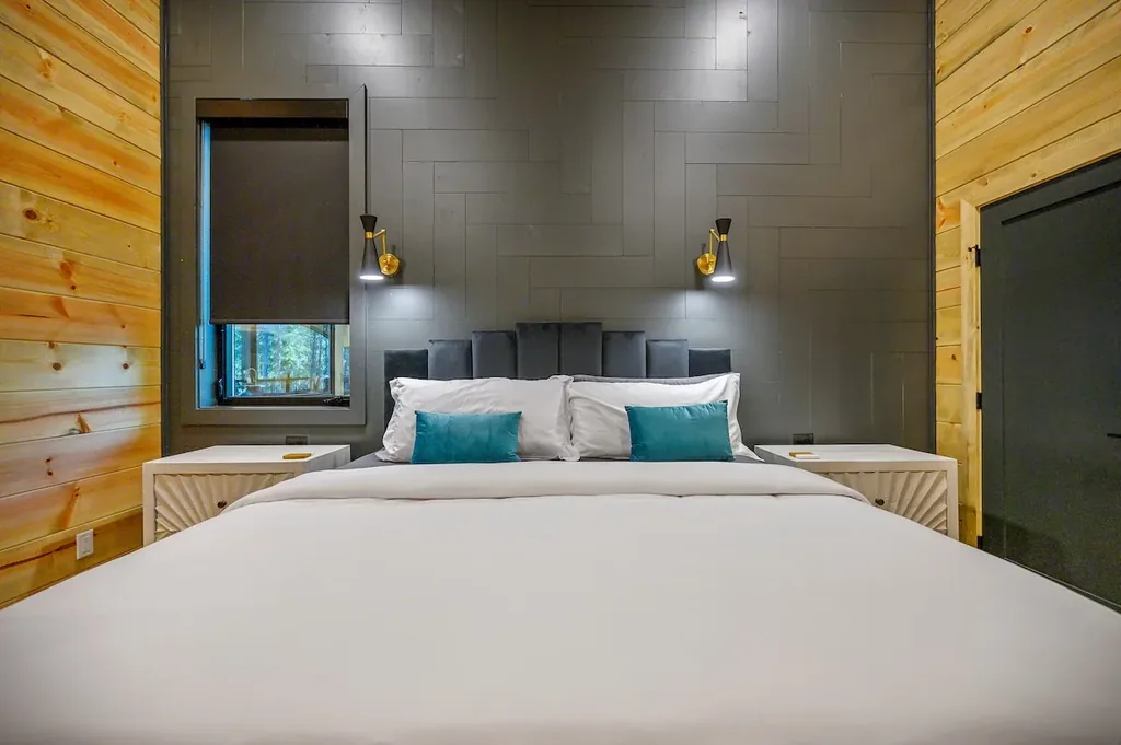 King Bedroom 2 with forest-view windows