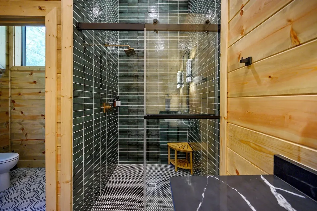 Full Bathroom 2 with glass shower and black vanity