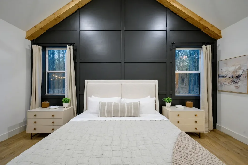 The Black-Beary — Wake up under a vaulted wood-beamed ceiling with tree views framed by windows on both sides of the bed.