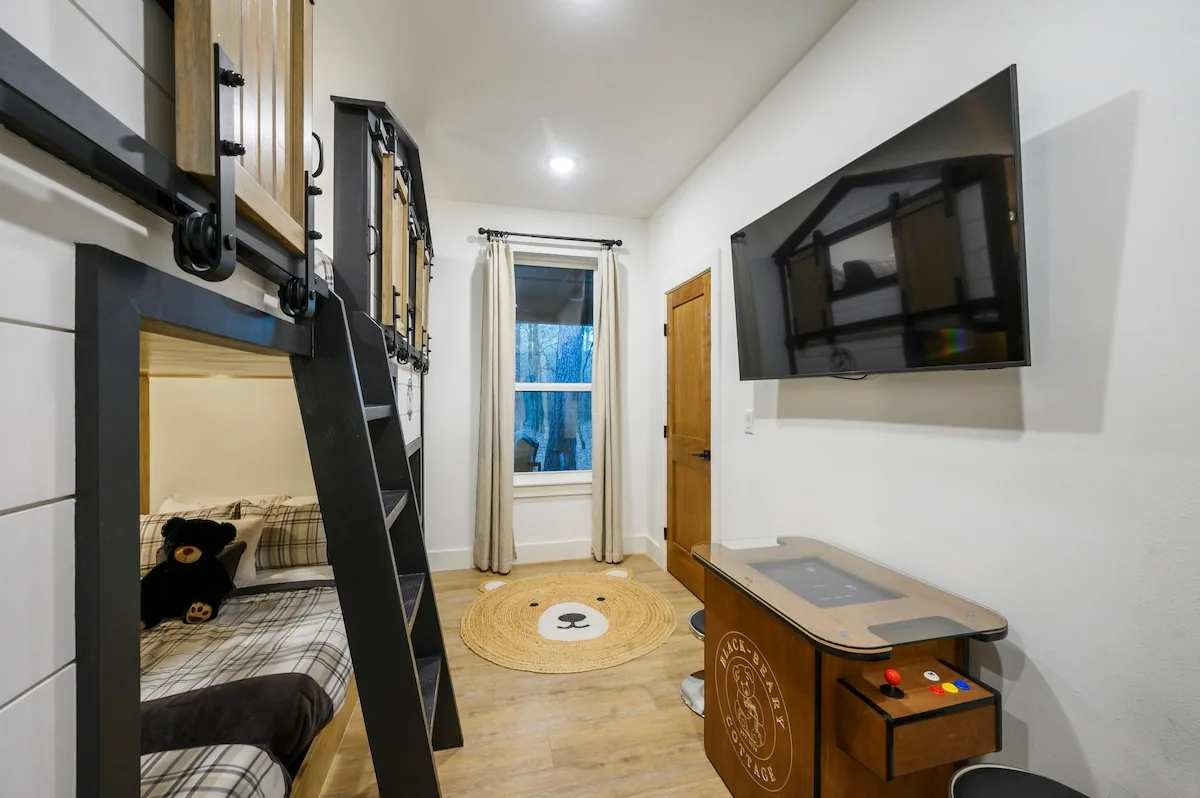 Main-floor bunk room with four queen beds