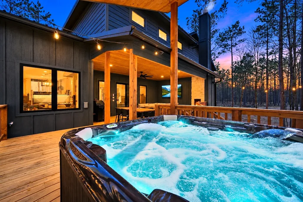 Private hot tub on Blue Note's covered deck at twilight