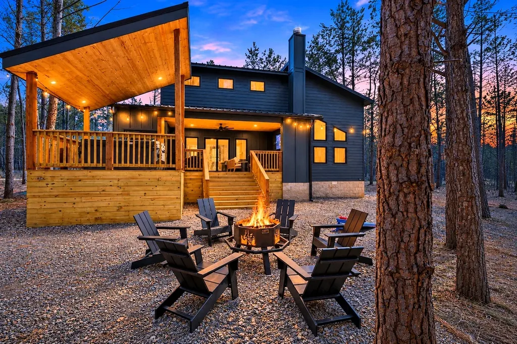 Private fire pit with Adirondack chairs at Blue Note at twilight
