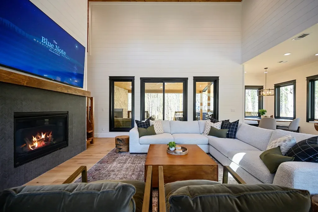 Blue Note living room with sectional seating and fireplace