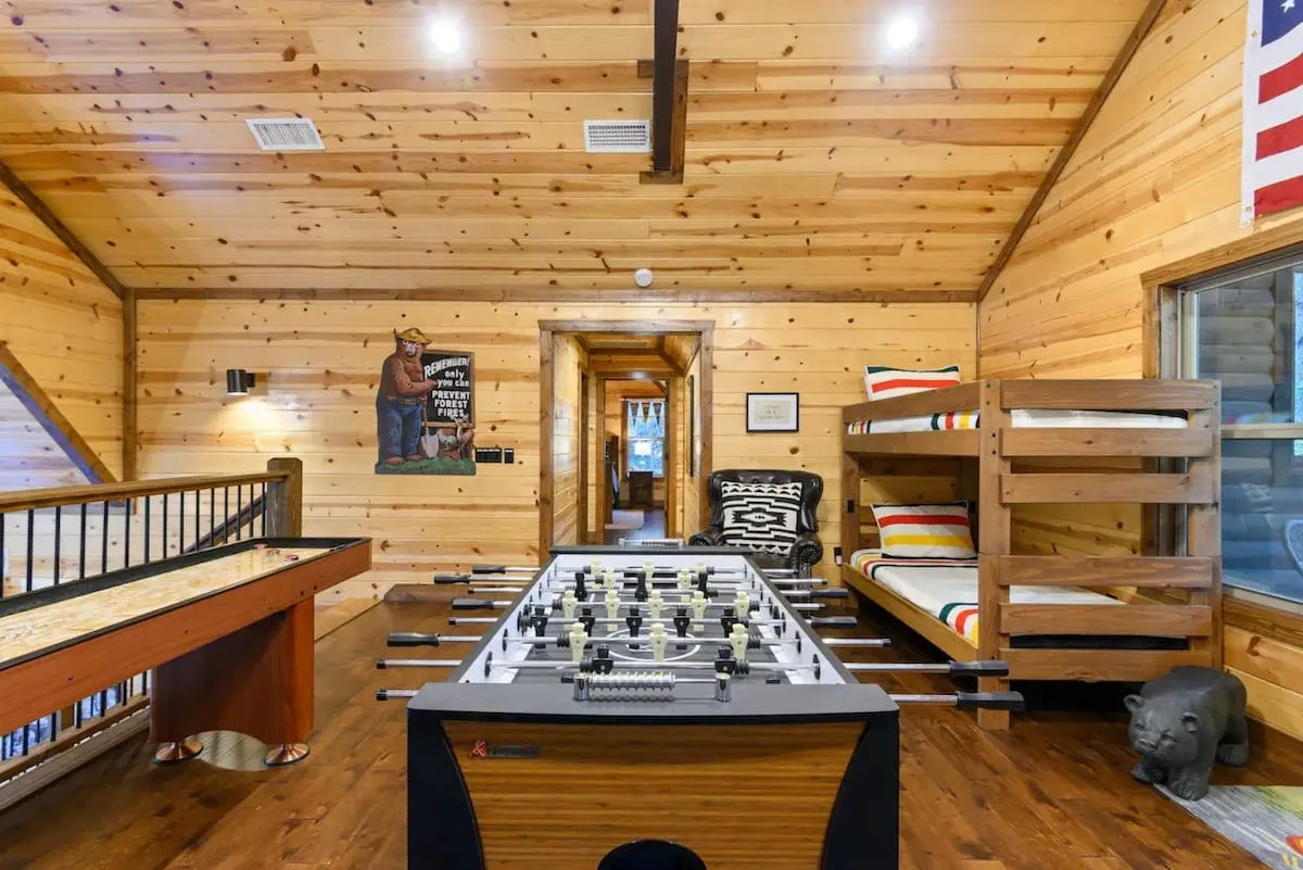 Open bunk and game loft with four twin beds at Cami's Campout