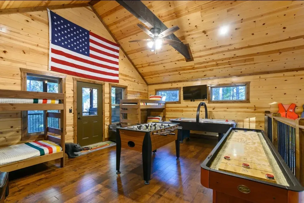 Bunk beds beside the games in the open Cami's Campout loft