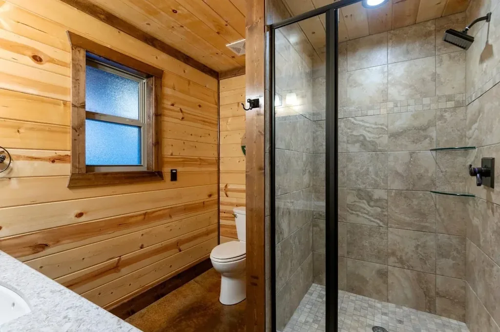 Walk-in shower in full bathroom 1 at Cami's Campout