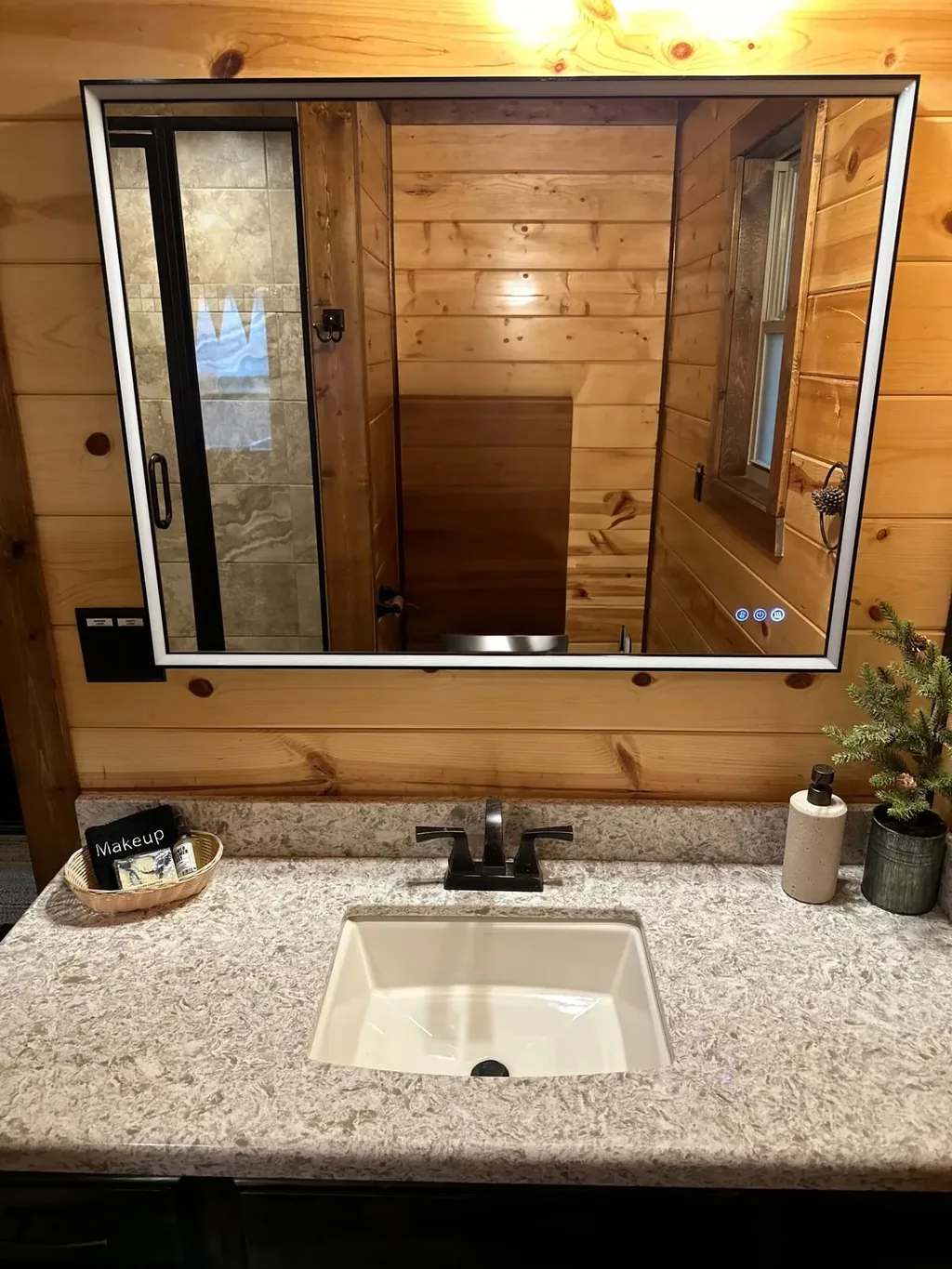 Illuminated vanity in full bathroom 2 at Cami's Campout