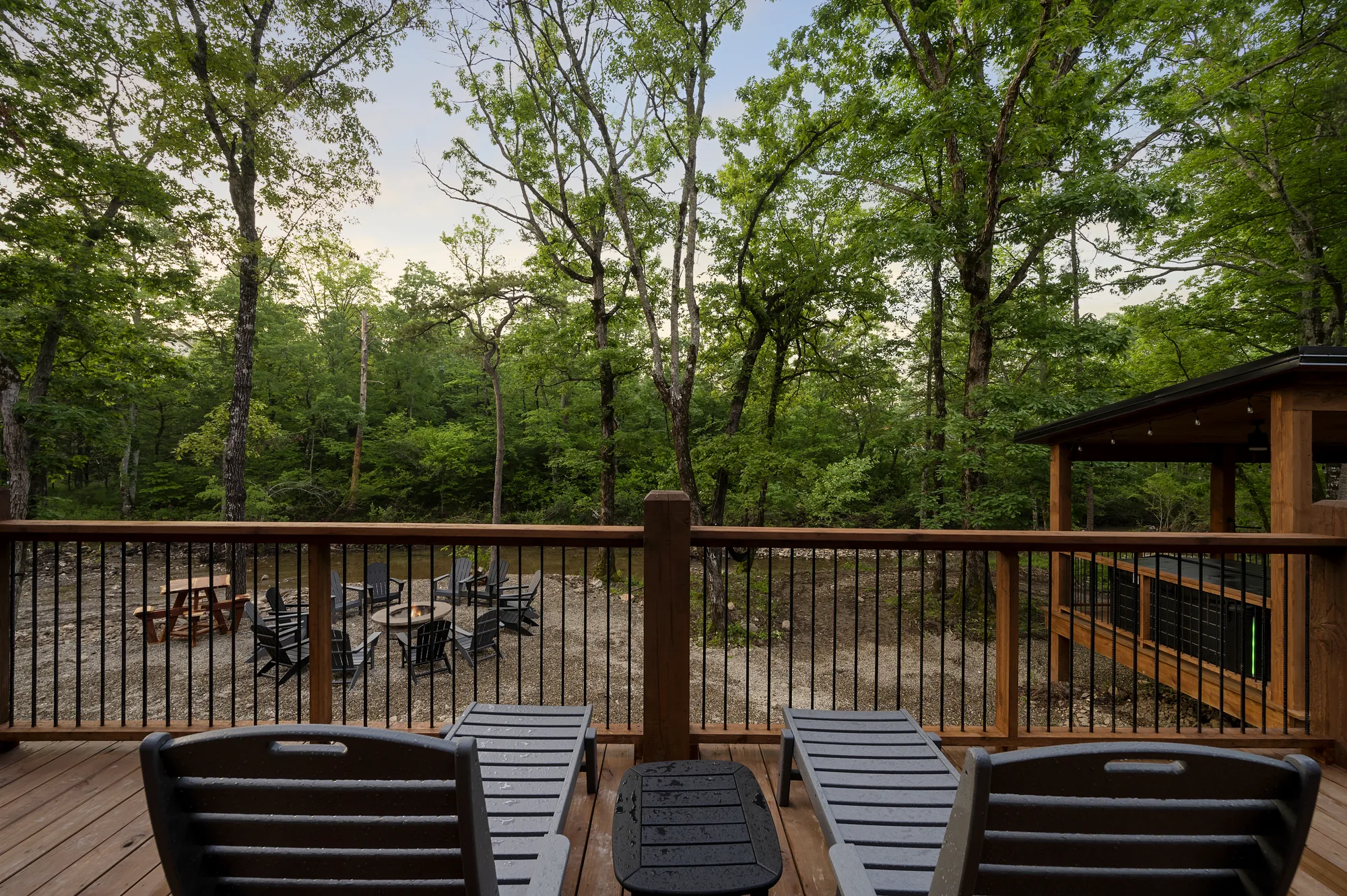 Bedroom with king bed and forest views at Dreams & Streams