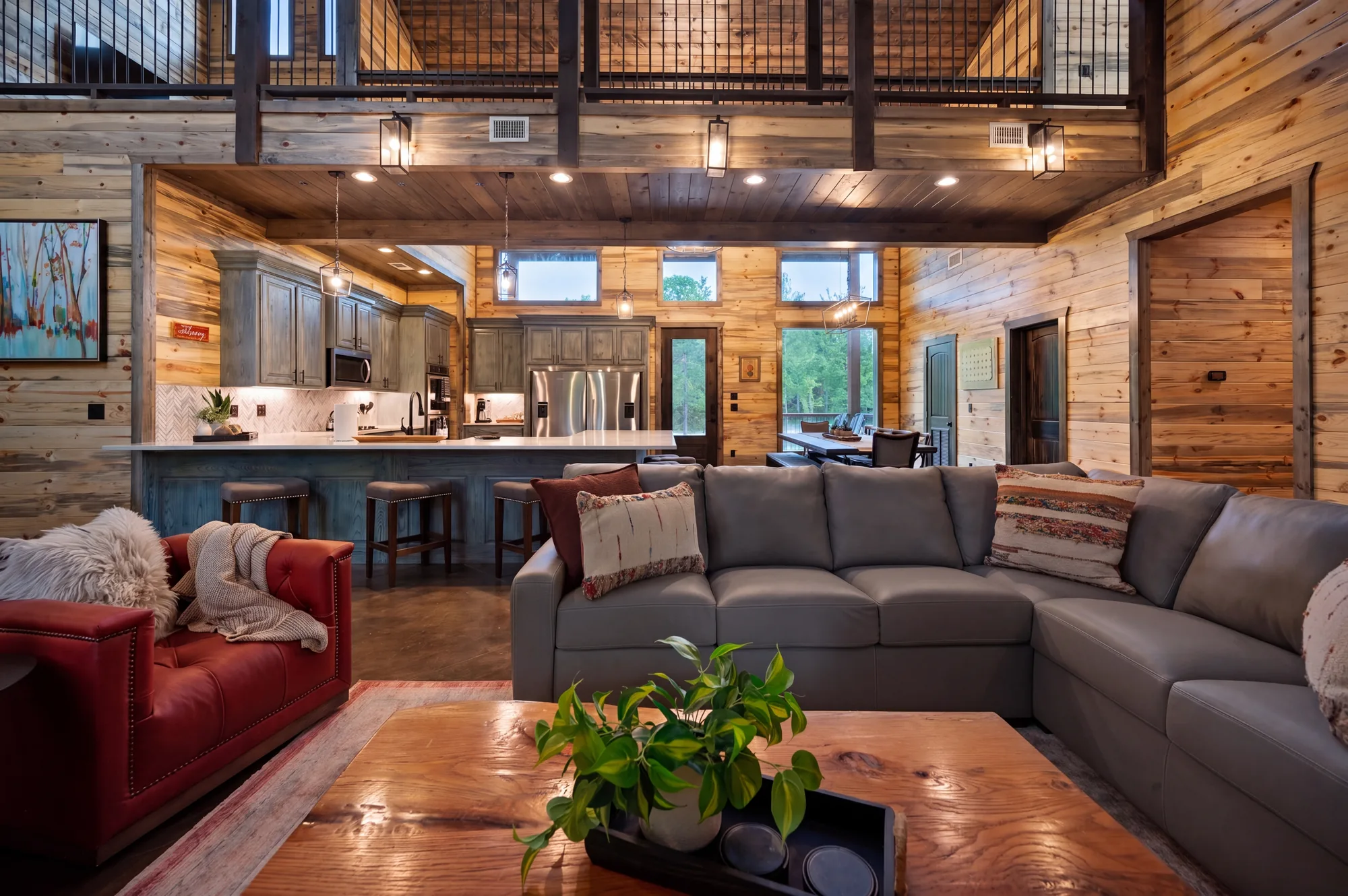 Open-concept great room with dining for sixteen at Dreams & Streams