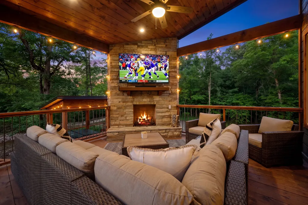 Outdoor fireplace seating area at Dreams & Streams