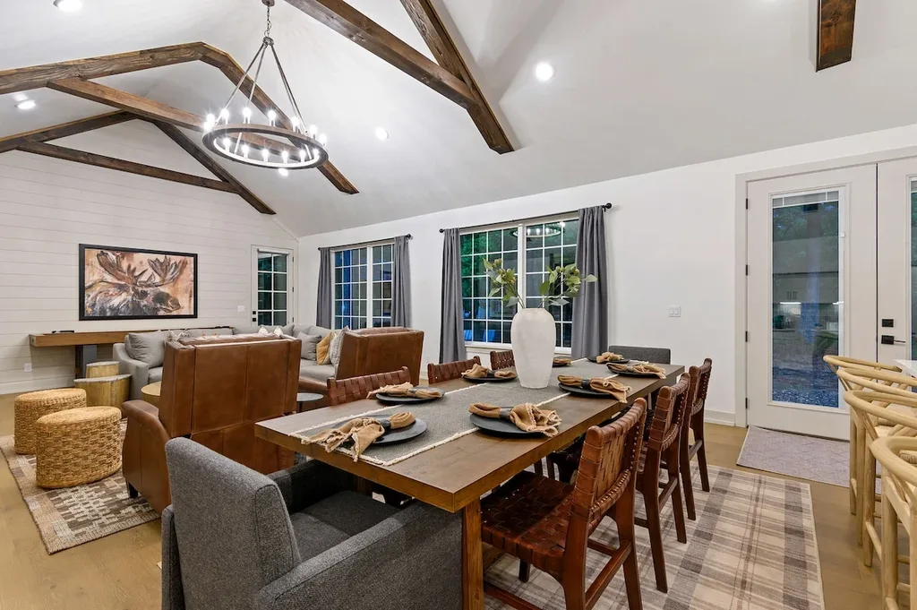 Dining area beneath exposed beams at Eleven:Eleven
