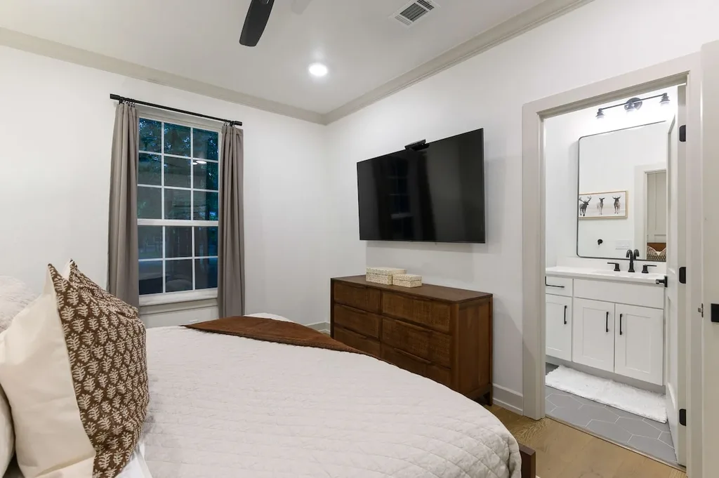 This king suite offers its own smart TV and private ensuite bath, so no sharing a bathroom with the rest of the group.