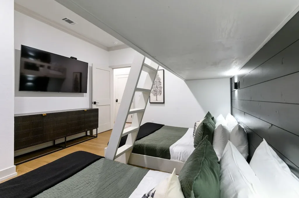 Bunk room with two queen beds and two single beds at Eleven:Eleven