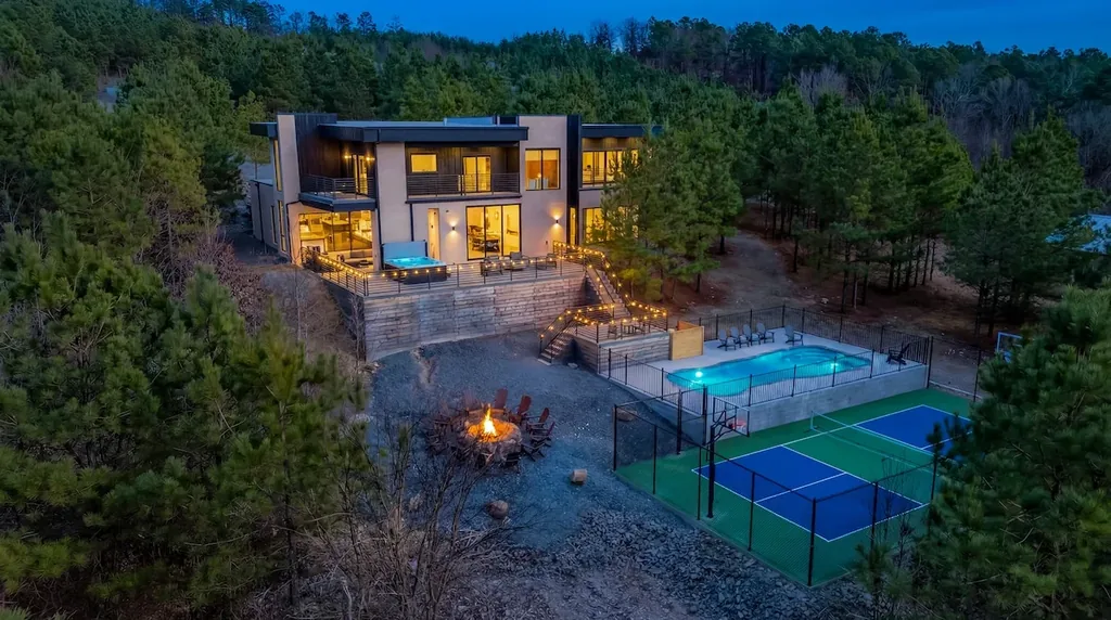 Aerial twilight view of The Jade with its private pool, sport court, and fire pit