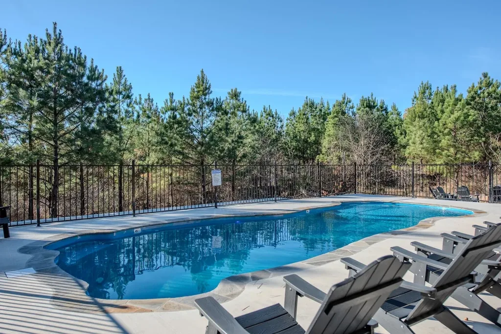 The Jade private pool with loungers and forest backdrop