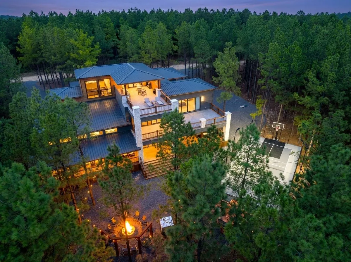 LivNLove luxury Broken Bow compound with rooftop deck and lighted sport court