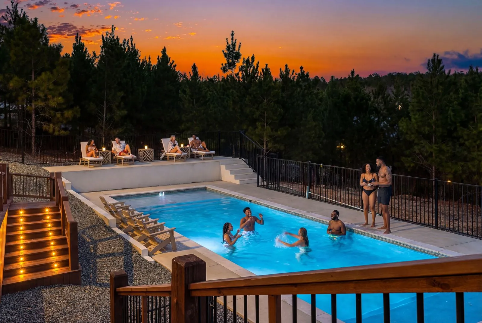 The Malibu Broken Bow cabin with private heated pool at twilight