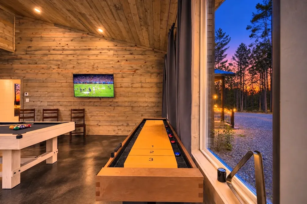 Miko Chukka — Rack up a game of pool or shuffleboard while the game plays on the wall-mounted TV, with a wooded view right outside the window.