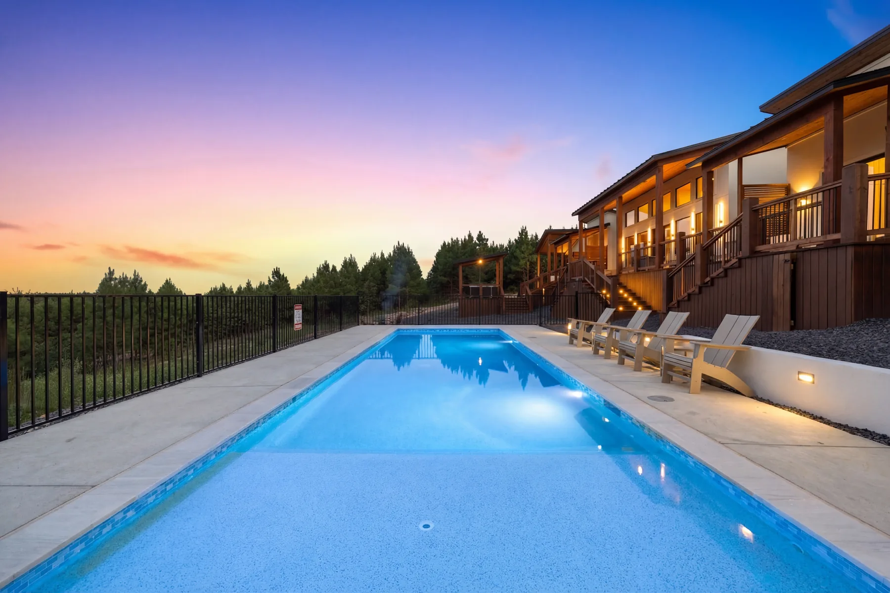 Private heated pool at sunset at a Haute Vie luxury cabin in Broken Bow, Oklahoma